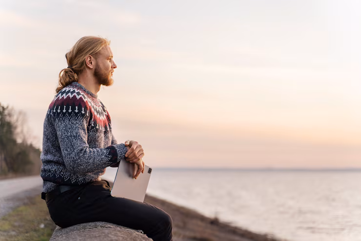 Person meditating in peaceful nature setting
